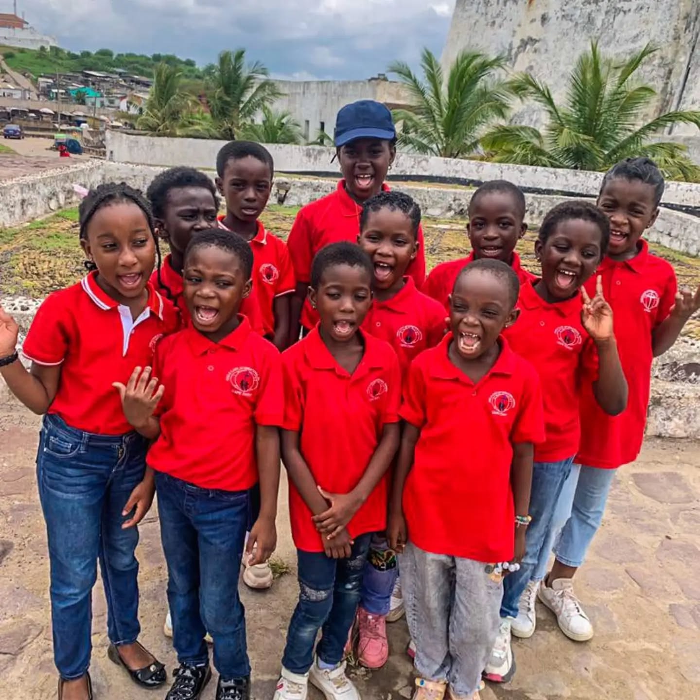 CCI pupils laughing together on a visit to Cape Coast Castle